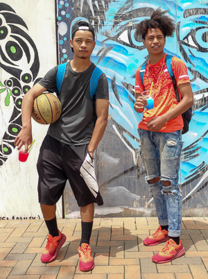 Two teenagers with a basketball